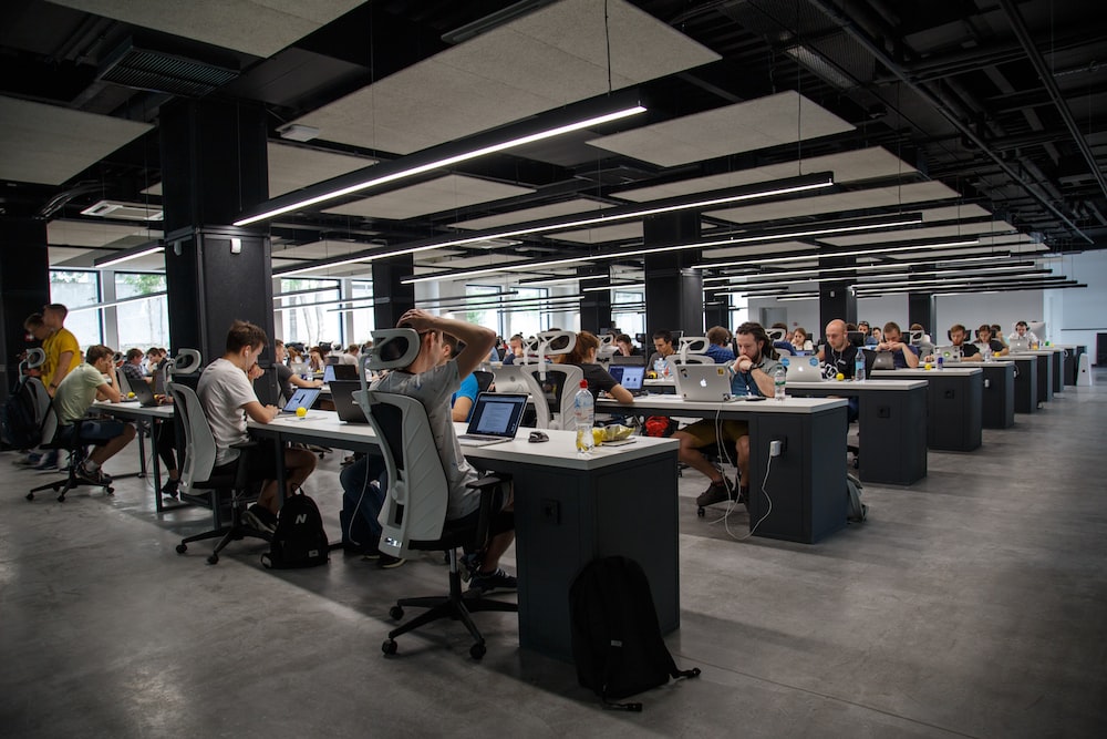 What are the four 4 advantages of open plan office layout?