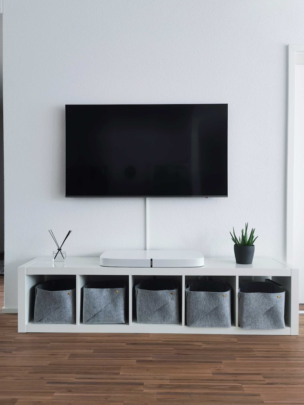 What should you put under a mounted TV?